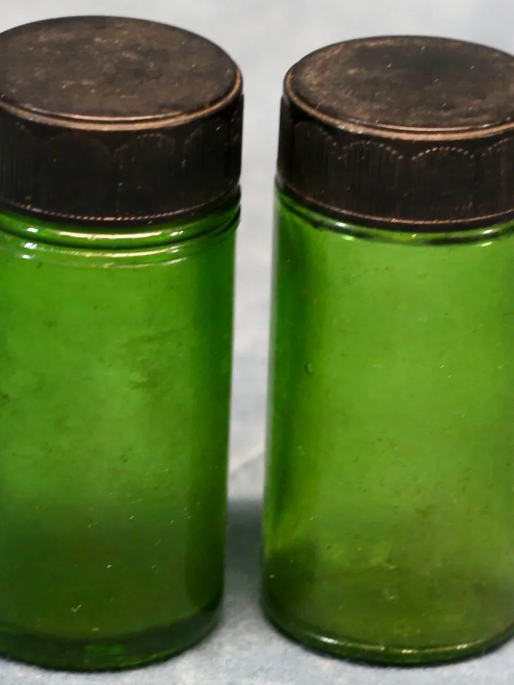 Vintage Green Glass Pill type bottles with inscriptions.  1 oz.